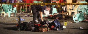 Bodies lie on the ground while police investigators inspect the area of a market where an explosion happened in Davao City, Philippines on Sep. 3, 2016.